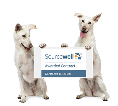 Dogs holding Sourcewell Sign